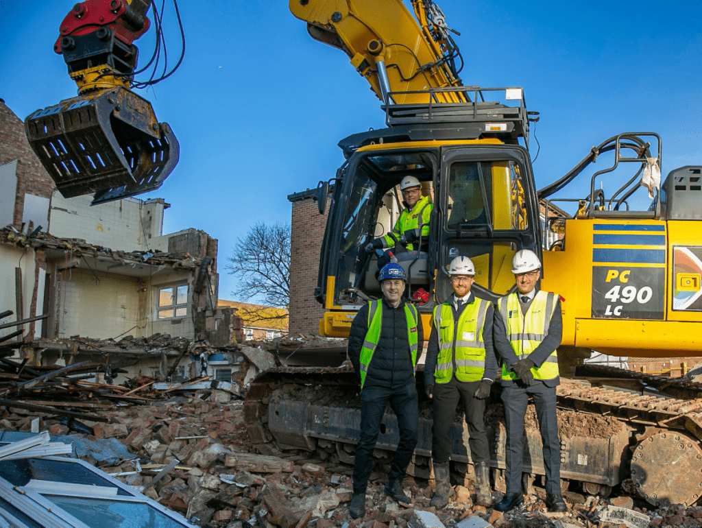 Cllr Darren Rodwell in the cab, Pat-Hayes, Josh Daniels and Adrian Fennessey on the demolition site